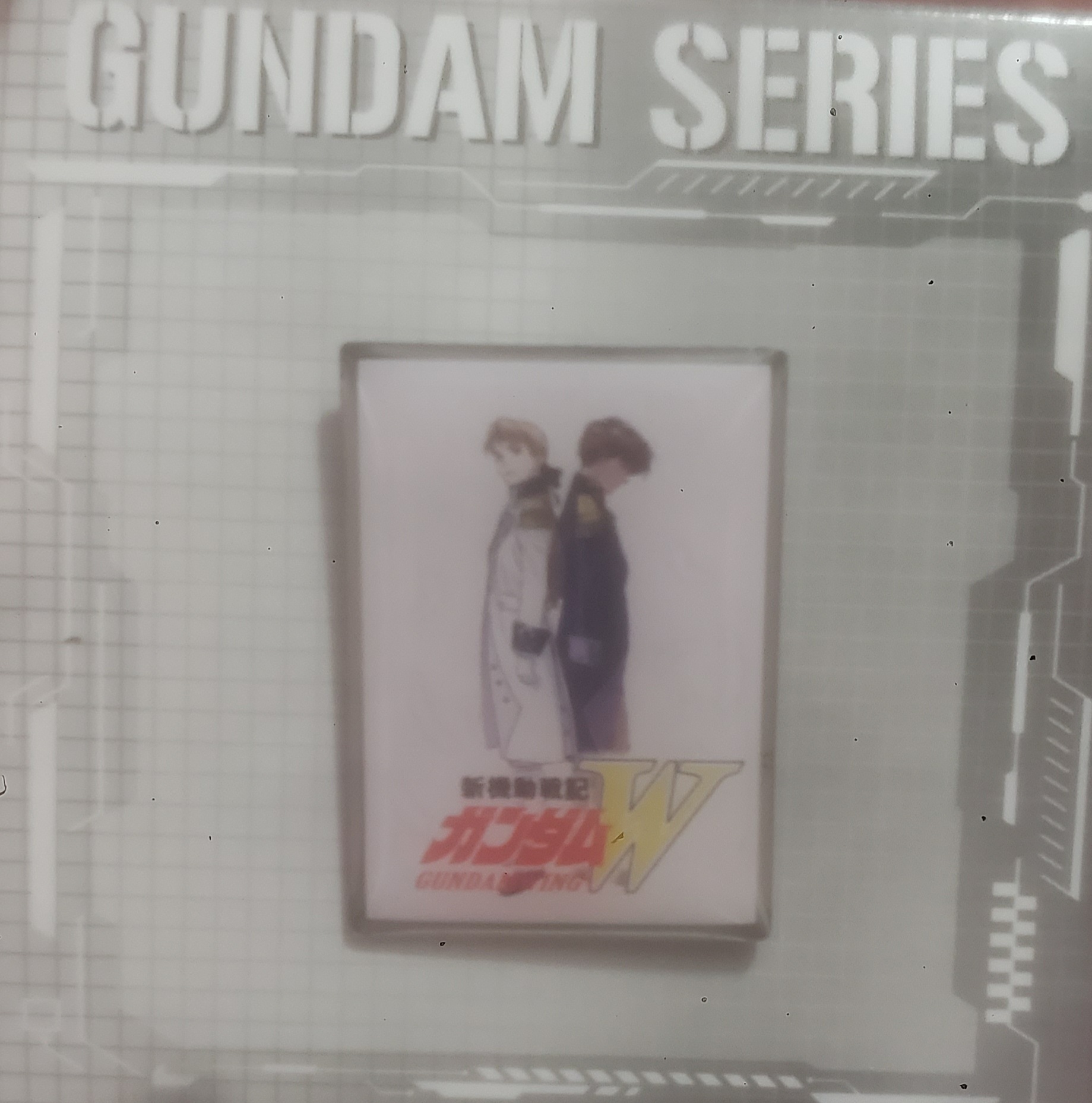 Gundam wing enamel pin with Heero and Relena in their Sanc Kingdom outfit standing back to back.